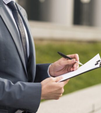 businessman-writing-clipboard